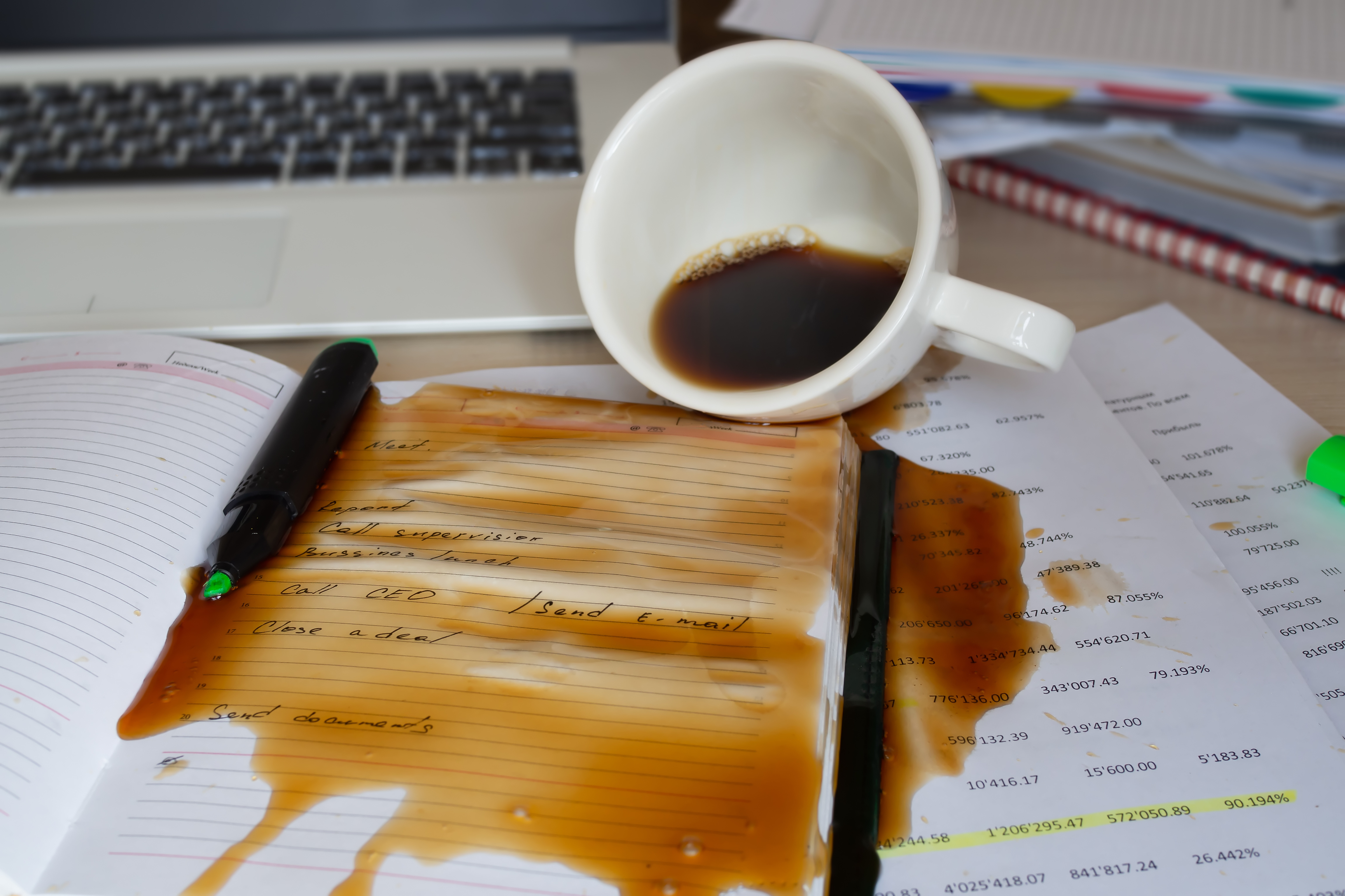 Spilled coffee on the desktop.