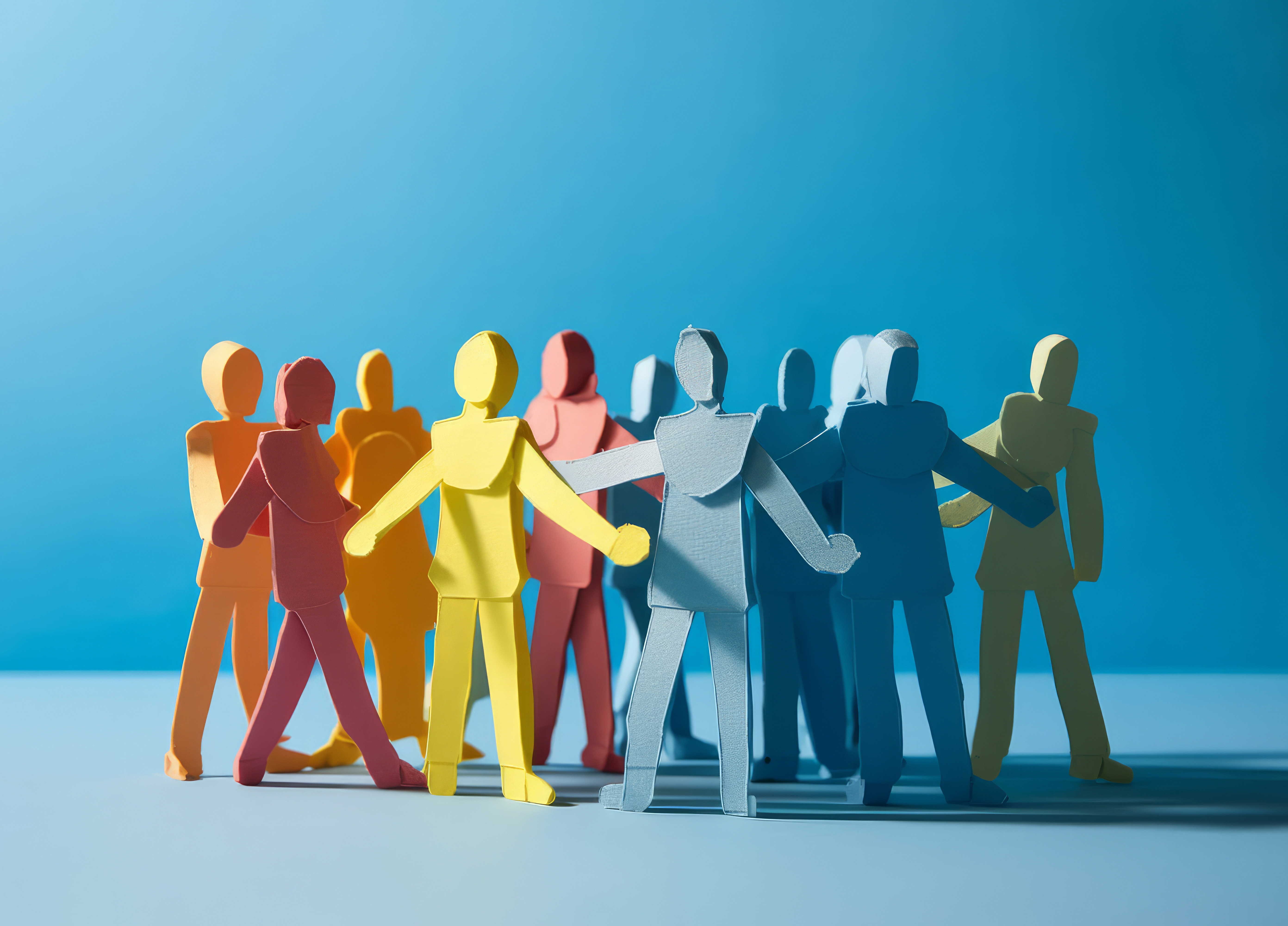 A group of paper people coming together. Community and friendship concept.