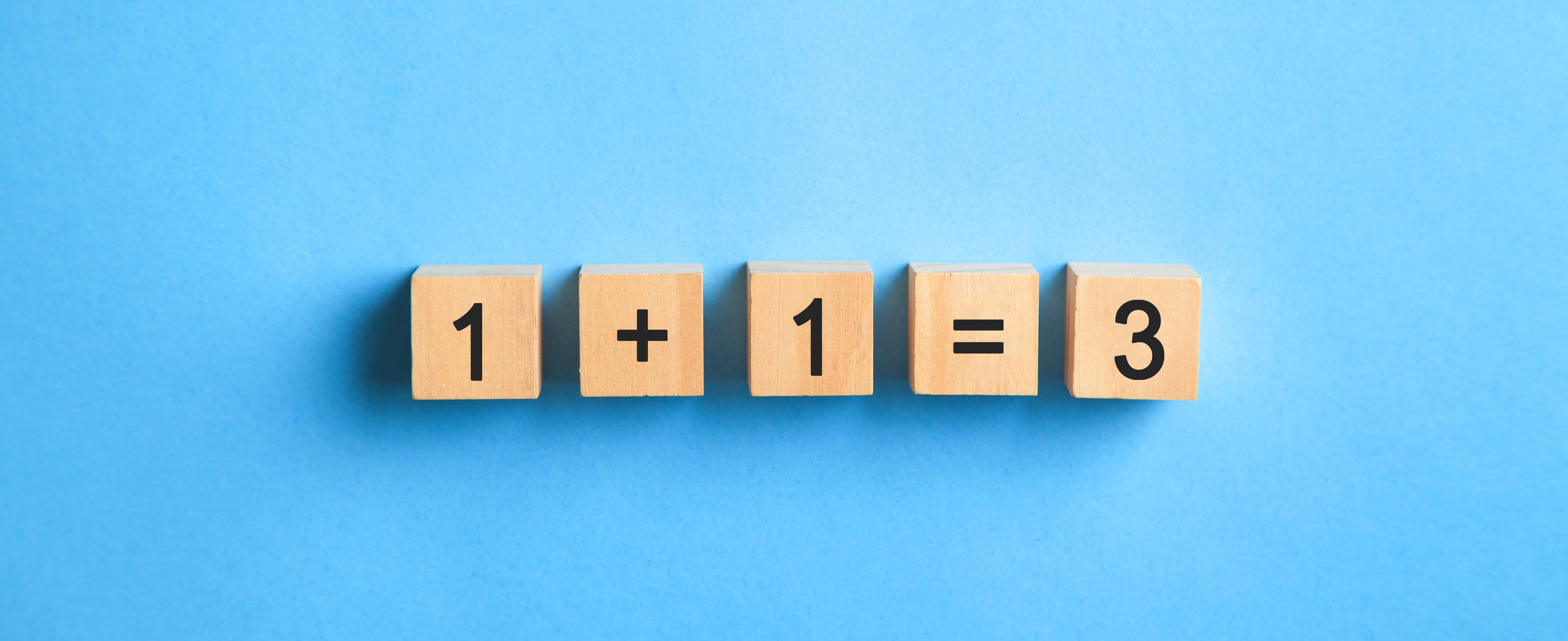 1+1=3 on wooden cubes. Synergy