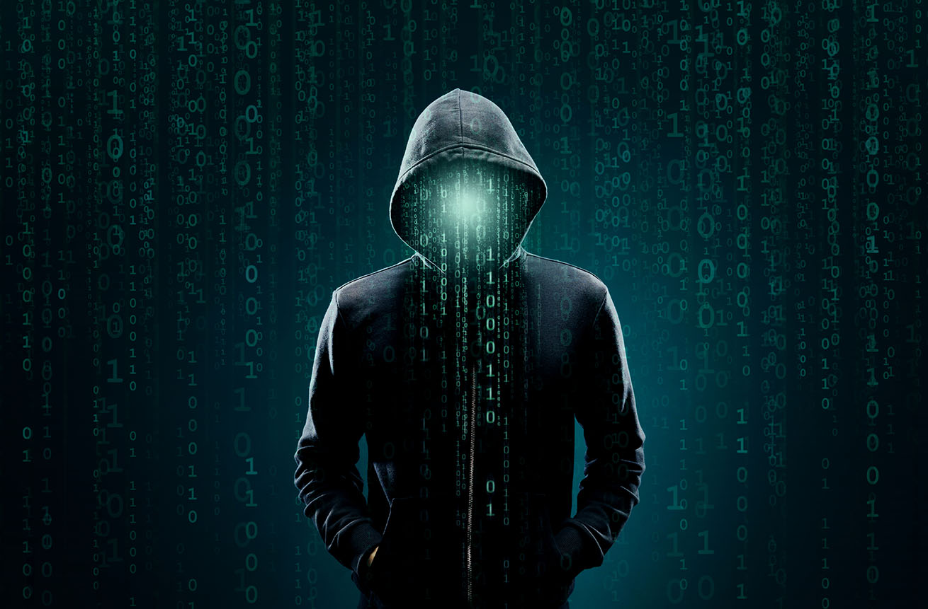 Portrait of computer hacker in hoodie. Obscured dark face. Data thief, internet fraud, darknet and cyber security concept.