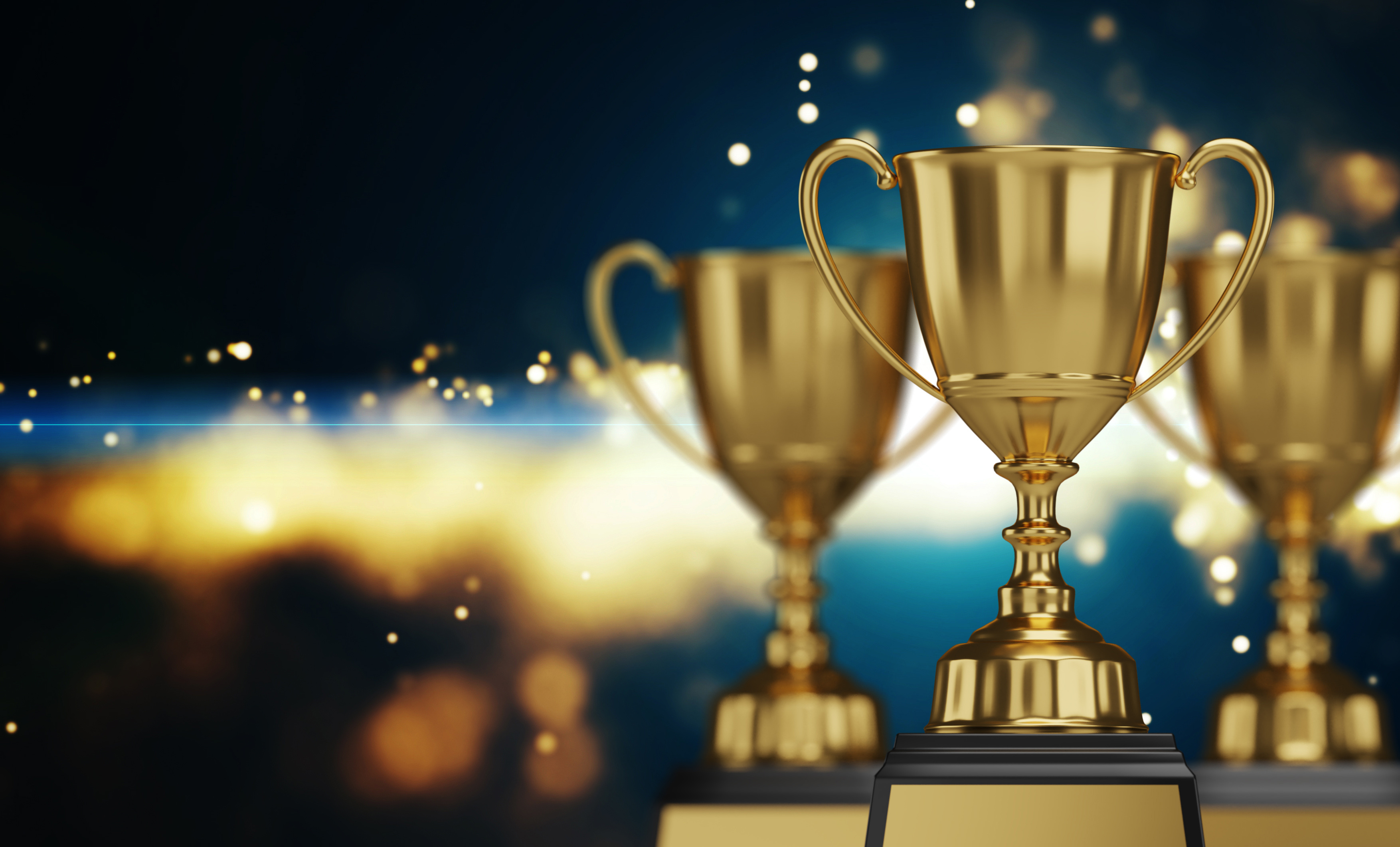 close up golden trophy award with falling confetti. copy space f